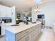 Modern kitchen with island, white cabinets, and stainless steel appliances at 120 Crooked Pine Rd, Port Orange, FL 32128