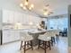 Modern kitchen with white cabinets and large island at 120 Crooked Pine Rd, Port Orange, FL 32128
