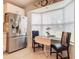Stainless steel refrigerator and kitchen nook with window seat at 120 Crooked Pine Rd, Port Orange, FL 32128