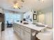 Modern kitchen with white cabinets and a large island at 120 Crooked Pine Rd, Port Orange, FL 32128