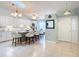 Modern kitchen with white cabinets, large island, and breakfast nook at 120 Crooked Pine Rd, Port Orange, FL 32128