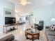 Open concept living room with view into kitchen and dining area at 120 Crooked Pine Rd, Port Orange, FL 32128