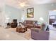 Spacious living room with comfortable seating and a view of the Primary bedroom at 120 Crooked Pine Rd, Port Orange, FL 32128