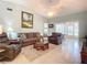 Bright living room with comfy seating and access to a sunroom at 120 Crooked Pine Rd, Port Orange, FL 32128