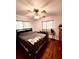 Spacious bedroom with wood flooring and ceiling fan at 12151 Se 86Th Ave, Belleview, FL 34420