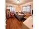 Charming bedroom with wood floors and plenty of natural light at 12151 Se 86Th Ave, Belleview, FL 34420