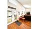 Bright entryway with hardwood floors and French doors leading to porch at 12151 Se 86Th Ave, Belleview, FL 34420