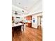 Large kitchen with island, hardwood floors, and wood cabinets at 12151 Se 86Th Ave, Belleview, FL 34420