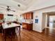 Spacious kitchen with island, hardwood floors, and wood cabinets at 12151 Se 86Th Ave, Belleview, FL 34420
