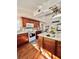 Well-lit kitchen with white appliances and an island at 12151 Se 86Th Ave, Belleview, FL 34420