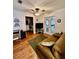 Cozy living room with wood floors, and access to patio at 12151 Se 86Th Ave, Belleview, FL 34420