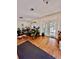 Bright sunroom with French doors leading to the backyard at 12151 Se 86Th Ave, Belleview, FL 34420