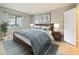 Main bedroom with wood bed frame and blue bedding at 127 Springwood Cir # A, Longwood, FL 32750