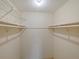 Walk-in closet with double hanging rods and wire shelving at 127 Springwood Cir # A, Longwood, FL 32750