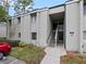 Exterior view of condo building with stairs and parking at 127 Springwood Cir # A, Longwood, FL 32750