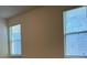 Bright bedroom with two windows and neutral wall colors at 16704 Point Rock Dr, Winter Garden, FL 34787