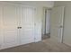 Bedroom with double door closet and access to hallway bath at 16704 Point Rock Dr, Winter Garden, FL 34787