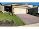 House exterior featuring a paver driveway and landscaping at 16704 Point Rock Dr, Winter Garden, FL 34787