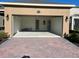 Spacious garage with paver driveway and open door at 16704 Point Rock Dr, Winter Garden, FL 34787