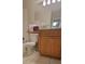 Clean bathroom with wood cabinets and a bathtub at 1695 Lee Rd # A209, Winter Park, FL 32789