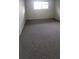 Spacious bedroom with carpeted floors and large window at 1695 Lee Rd # A209, Winter Park, FL 32789