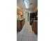 Kitchen with wood cabinets, black appliances, and tile floor at 1695 Lee Rd # A209, Winter Park, FL 32789