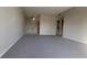 Spacious living room with grey carpet and access to a balcony at 1695 Lee Rd # A209, Winter Park, FL 32789