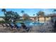 Community pool with lounge chairs and surrounding landscaping at 1695 Lee Rd # A209, Winter Park, FL 32789