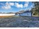 House exterior view showcasing large backyard at 17 Walnut Crse, Ocala, FL 34480