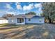 House exterior view with backyard and screened porch at 17 Walnut Crse, Ocala, FL 34480