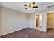 Bedroom with ceiling fan and en-suite bathroom at 17 Walnut Crse, Ocala, FL 34480
