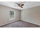 Spacious bedroom with ceiling fan and neutral decor at 17 Walnut Crse, Ocala, FL 34480