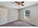 Spacious bedroom with a ceiling fan and window at 17 Walnut Crse, Ocala, FL 34480