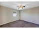 Simple bedroom with ceiling fan and window at 17 Walnut Crse, Ocala, FL 34480