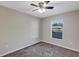 Bright bedroom with ceiling fan and window at 17 Walnut Crse, Ocala, FL 34480