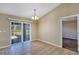 Bright dining area with tile flooring and sliding glass doors leading outside at 17 Walnut Crse, Ocala, FL 34480