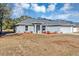 Gray house with a two-car garage and landscaping at 17 Walnut Crse, Ocala, FL 34480