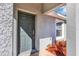 Gray front door entryway with red mulch at 17 Walnut Crse, Ocala, FL 34480