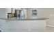 Modern kitchen features granite countertops and stainless steel appliances at 17 Walnut Crse, Ocala, FL 34480