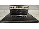 Stainless steel electric cooktop with four burners at 2025 Erving Cir # 207, Ocoee, FL 34761