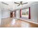 Bright living room with hardwood floors and ceiling fans at 205 9Th St, St Cloud, FL 34769