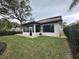 Spacious backyard with screened patio and grassy area at 205 Hazard St, Orlando, FL 32804