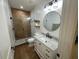Beautiful bathroom featuring wooden style tile, shiplap walls and a glass-enclosed shower at 205 Hazard St, Orlando, FL 32804