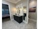 Modern bathroom with a dark vanity, stylish mirror, and contemporary lighting fixtures at 205 Hazard St, Orlando, FL 32804
