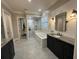Lavish bathroom with a soaking tub, a tiled shower, and double sink vanity at 205 Hazard St, Orlando, FL 32804