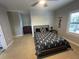 Bedroom featuring a black and white patterned bedspread and carpeted flooring at 205 Hazard St, Orlando, FL 32804