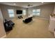 Large bonus room with comfortable seating and plenty of natural light at 205 Hazard St, Orlando, FL 32804