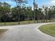 Curved driveway leading to home with mature landscaping at 205 Hazard St, Orlando, FL 32804