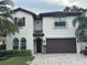 Two-story house with a brown garage door and gray brick driveway at 205 Hazard St, Orlando, FL 32804