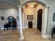 Elegant foyer with columns, an arched doorway, and decorative furnishings at 205 Hazard St, Orlando, FL 32804